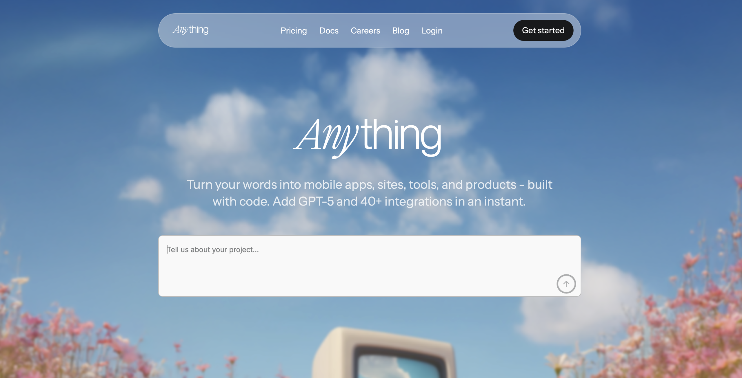 Anything (formerly Create.xyz) AI app builder: a chat prompt generating a full-stack app preview with built-in database and payments